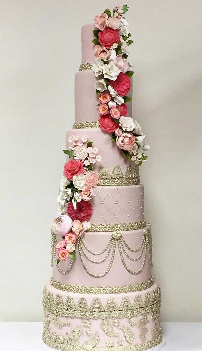 Blush pink elegant wedding cake with cascading flowers #wedding #weddingcake pretty and unique wedding cakes, wedding cake ideas, wedding cake , wedding cake ideas 2019, wedding cake ideas rustic, unique wedding cake designs, luxury wedding cake ideas, elegant wedding cake, modern wedding cake designs, wedding cake pictures gallery