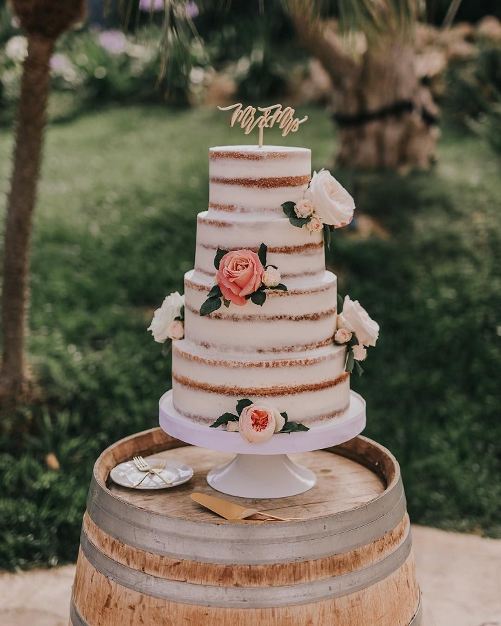 Semi naked wedding cake adorned with flowers #wedding #weddingideas #weddingcake