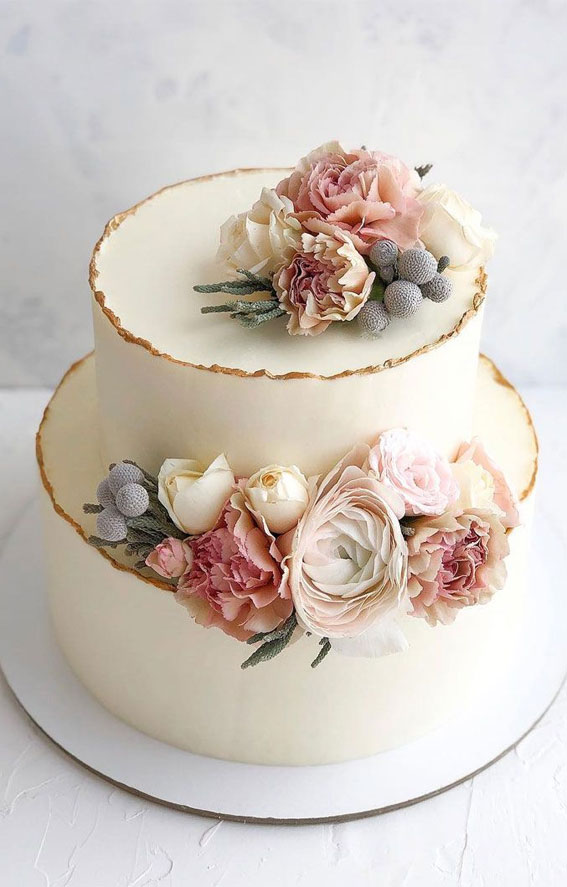 two tier wedding cake, wedding cake, powder colored wedding cake , simple wedding cake #weddingcake #weddingcakes two tier white wedding cake adorned with flowers