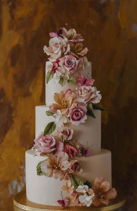 The 50 Most Beautiful Wedding Cakes, A cascading garden of sugar flowers and butterflies, sugar flower wedding cake #wedding #weddingcake 