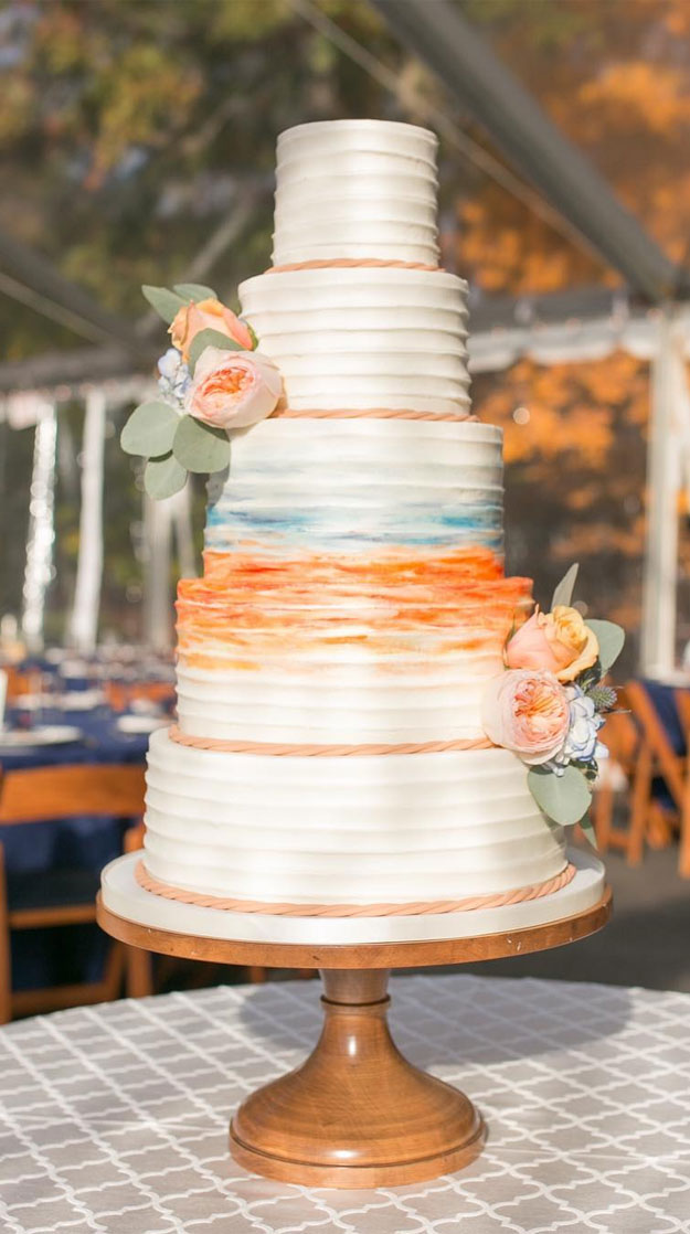 This cake featured buttercream-iced tiers with a beautiful watercolor finish and rope borders for a nautical feel, five tier wedding cakes #weddingcake 