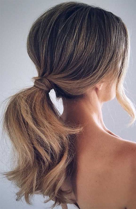 Voluminous Messy Ponytail with Loose Face Framing Pieces on Dark Brunette  Hair  The Latest Hairstyles for Men and Women 2020  Hairstyleology