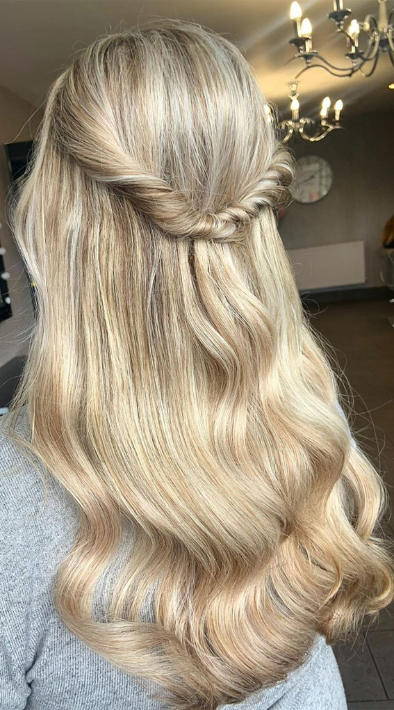 Image of Loose half up half down hairstyle with waves