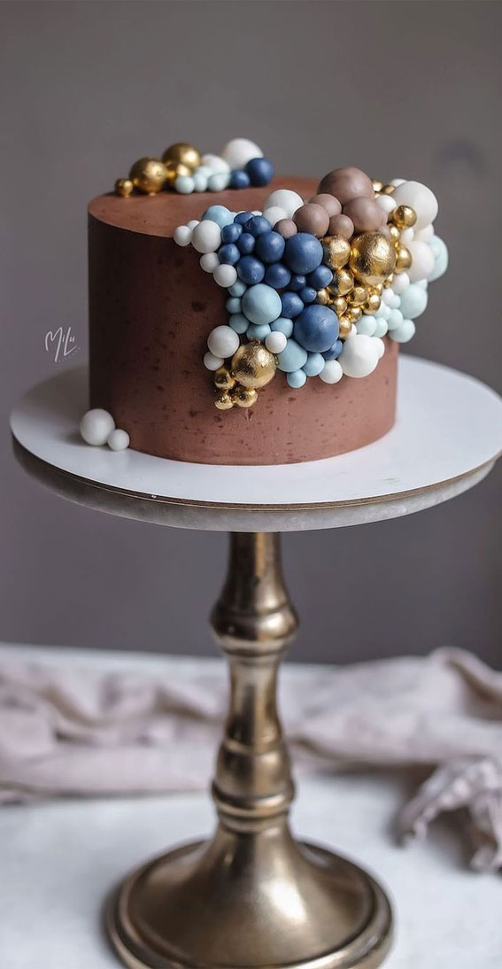 chocolate cake decorated with different sizes of balls, birthday cake, cake designs 2020, cake ideas, buttercream cake, buttercream cake ideas, birthday cake ideas #birthdaycake