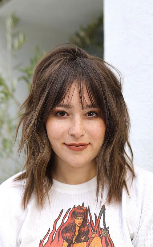 Image of Blunt bangs with a blunt cut medium shaggy hairstyle