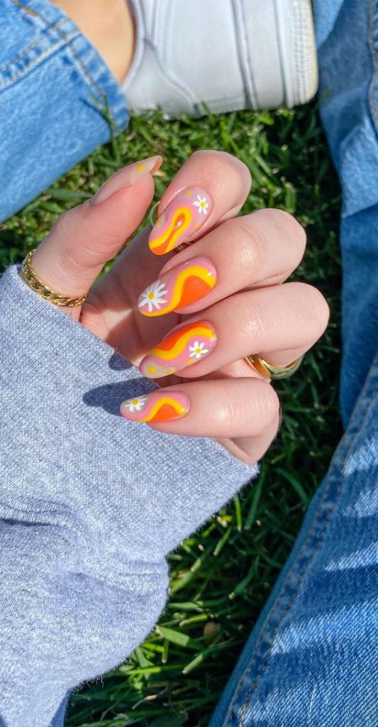 Summer nail art ideas to rock in 2021 : Orange Swirl Nails with Daisy