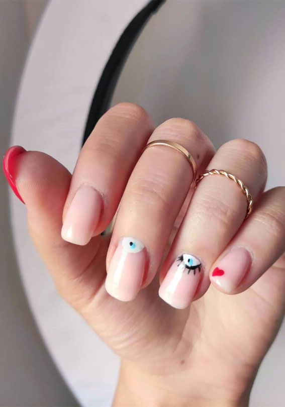 29 Summer Aesthetic Nails Designs 2021 : Evil eye & red heart nails