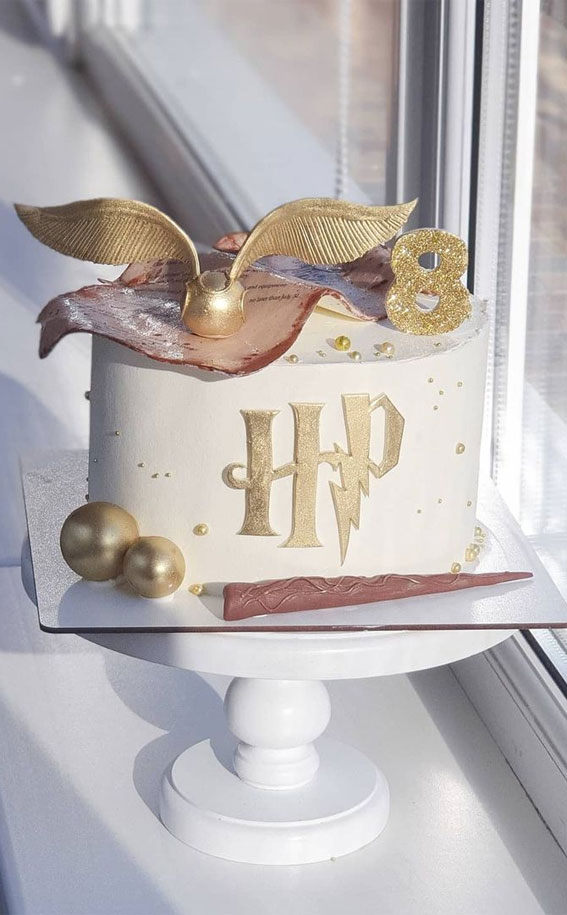 white harry potter cake with golden snitch, harry potter cake, harry potter cake designs, harry potter birthday cake, harry potter themed cake, birthday cake ideas 