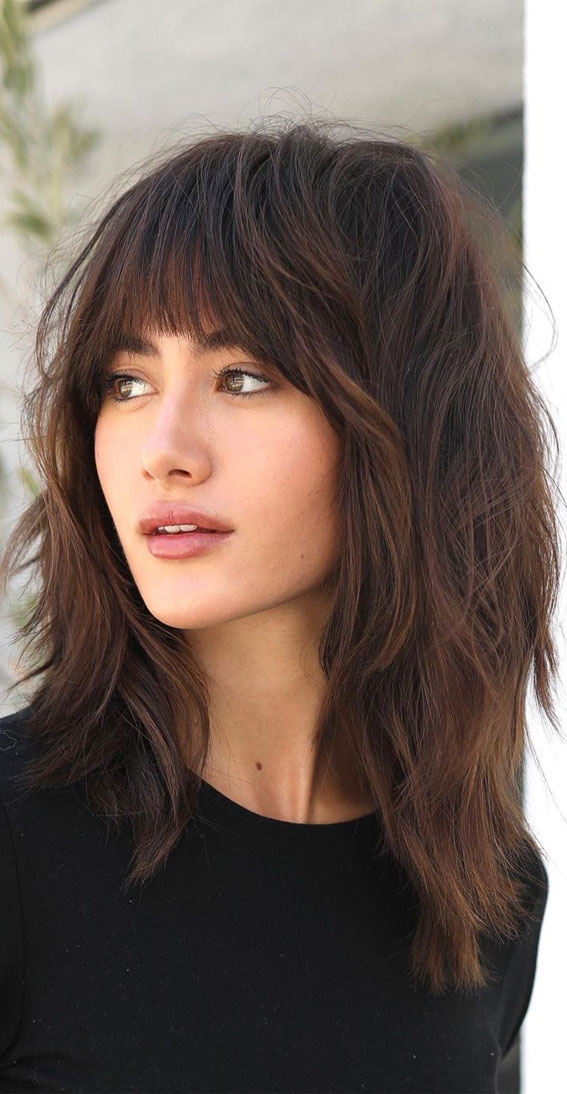 This is why the long layered hair with bangs trend is still going strong