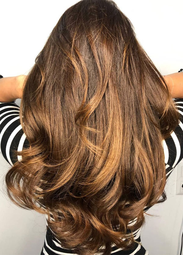 beautiful golden brown hair, layered hair cut with curtain bangs, hair color trends 2022, brunette hair color ideas, golden brown highlights