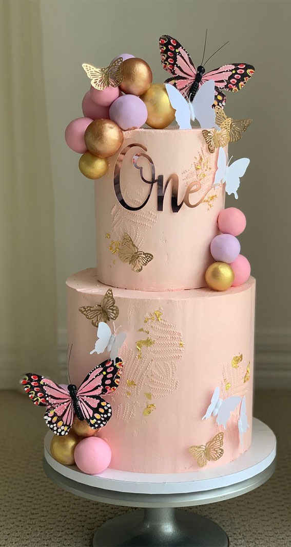 25 Baby Girl First Birthday Cake Ideas : Two-Tiered Pink Cake Adorned with Butterflies