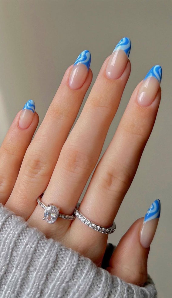 wavy blue french nails, french tips, colorful french tip nails, coloured french tips short nails, coloured french tip nails, modern french manicure, french manicure 2022, colored tips acrylic nails, french manicure ideas, colored tips nails, blue french tip nails, colored french tips almond