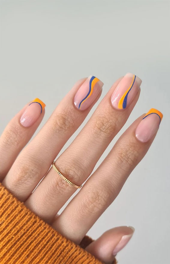 32 Prettiest Autumn 2022 Nail Trends to Try Now : Blue and Orange Swirl Nails