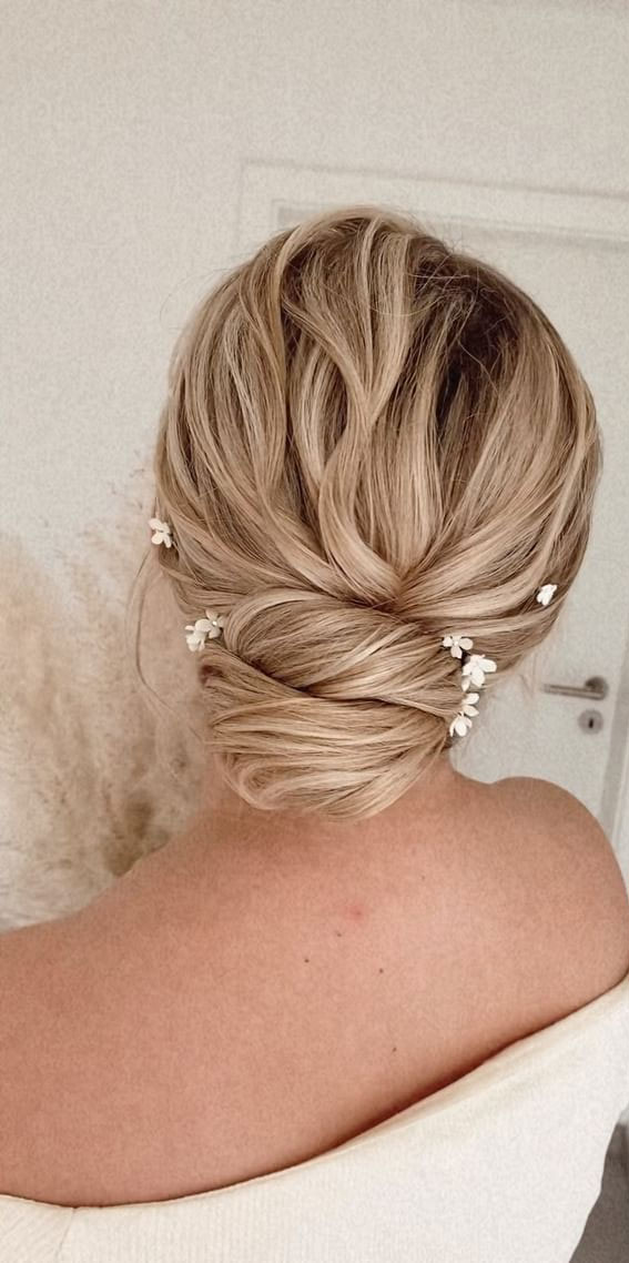 59 Gorgeous Wedding Hairstyles in 2022 : Twisted Low Bun + White Floral