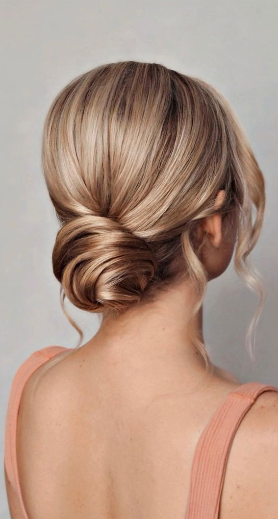 53 Best Wedding Hairstyles for 2023 Brides : Classic Twisted Low Bun