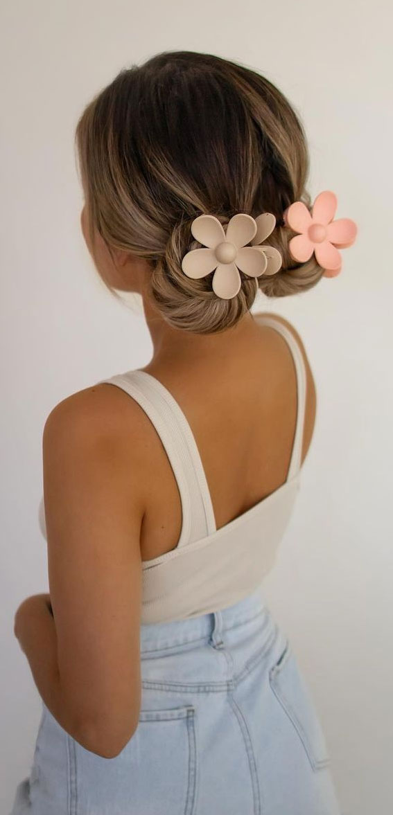 Cute Hairstyles That’re Perfect For Warm Weather : Simple Double Low Buns with Flower Hairclips