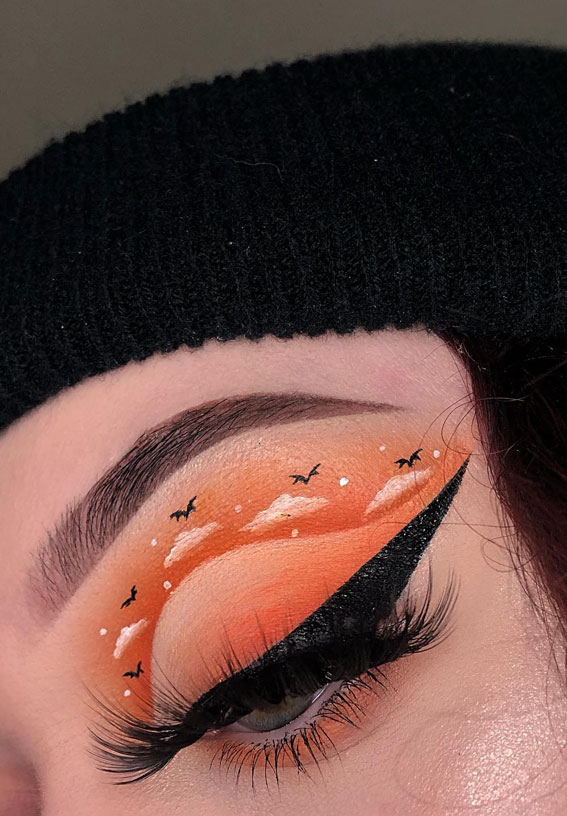 Ghoulish Glam 50+ Spooky Halloween Eye Makeup Ideas : Spooky Orange Skies