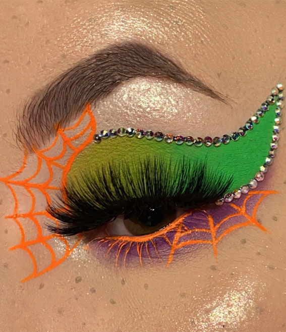 Ghoulish Glam 50+ Spooky Halloween Eye Makeup Ideas : Bright Orange Cob Web