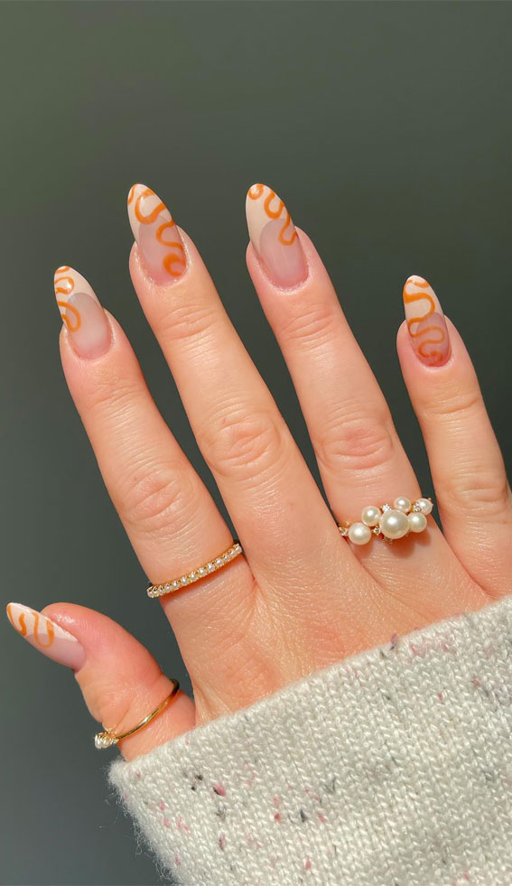 50+ Charming Fall Nail Art to Adorn Your Tips : Beige Tip Nails with Orange Swirl