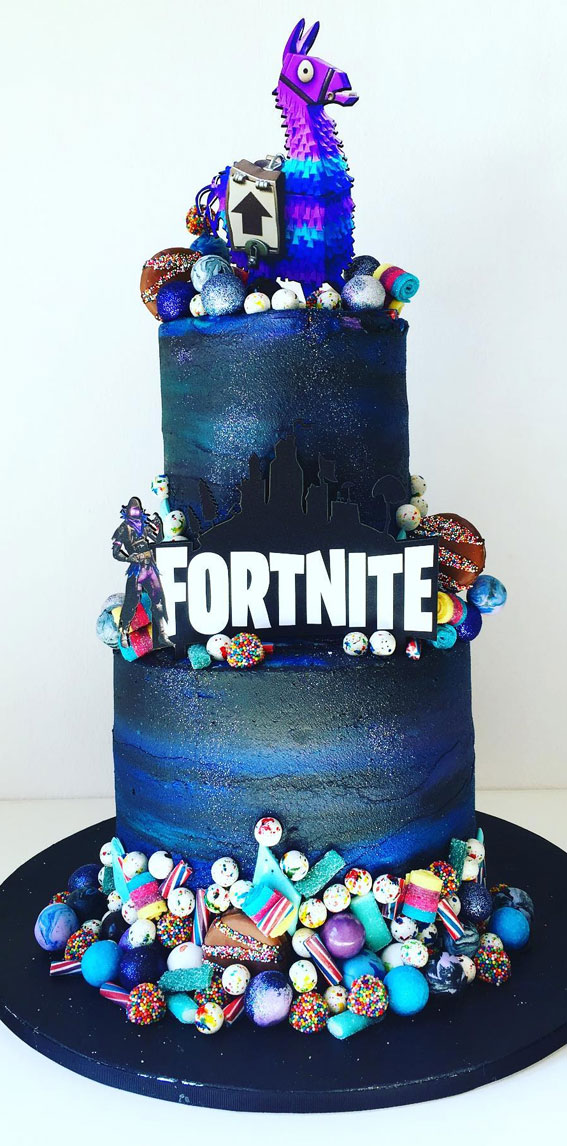 Fortnite Cake Ideas To Inspire You : Two-Tiered Dark Cake with Lots of Sweet