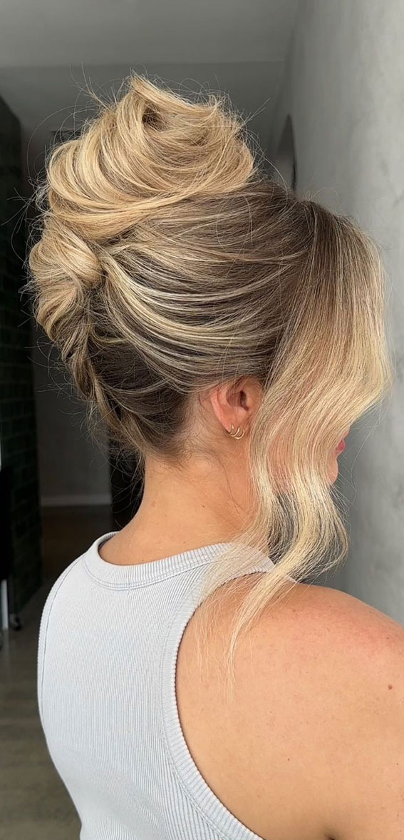 Chic Updos To Elevate Your Hair Game : Messy Twist High Updo with Side Face Frames