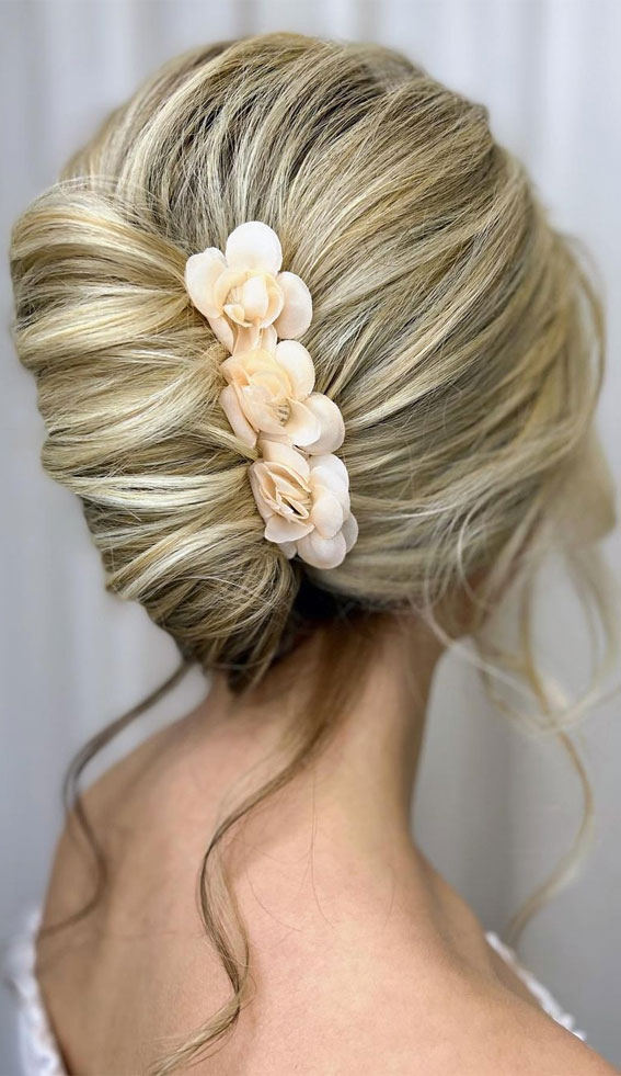 Chic Updos To Elevate Your Hair Game : French Twist with Flower Accessories