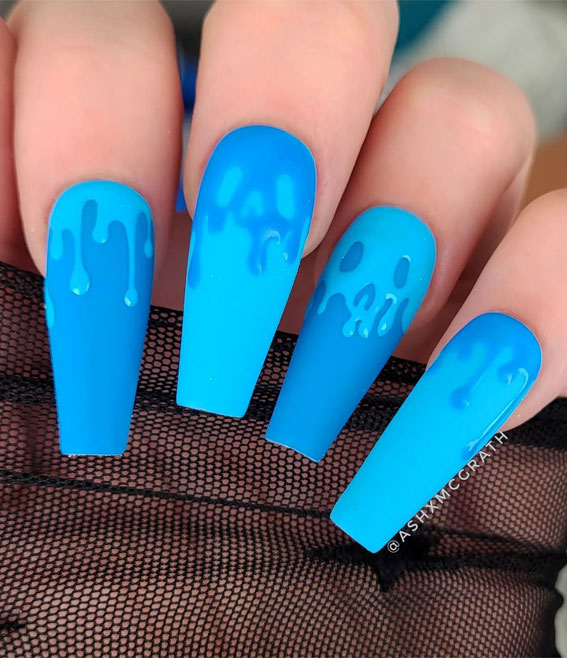 Dazzling Halloween Nails that Turn Heads : Melted Skull Blue Nails, Halloween nails, simple spooky nails, Halloween Nail Art