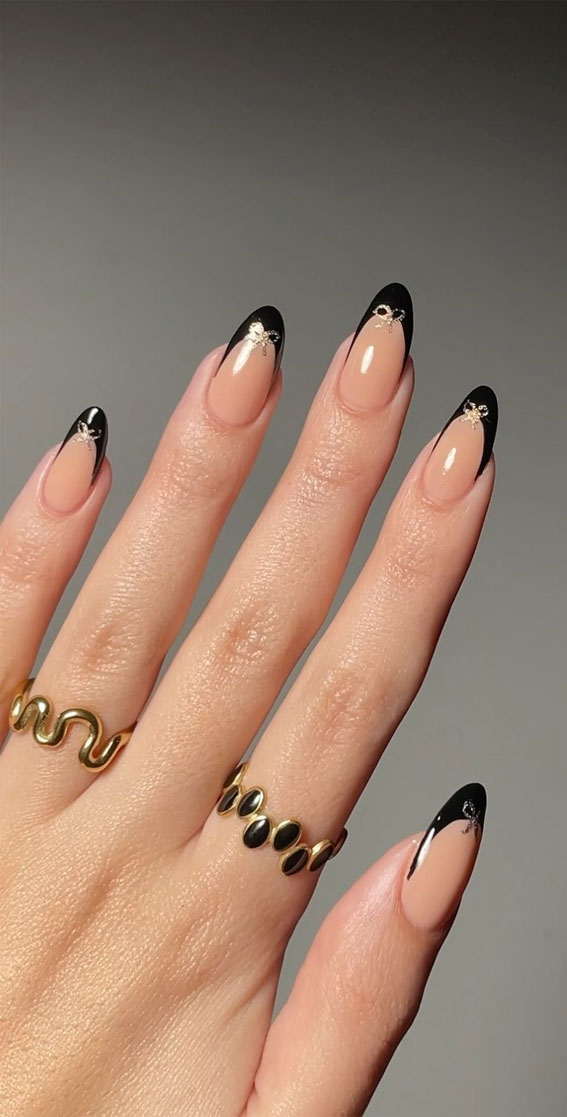 Glitter Nail Art Ideas for Glimmering Festivities : Black Tip Nails with Gold Bows