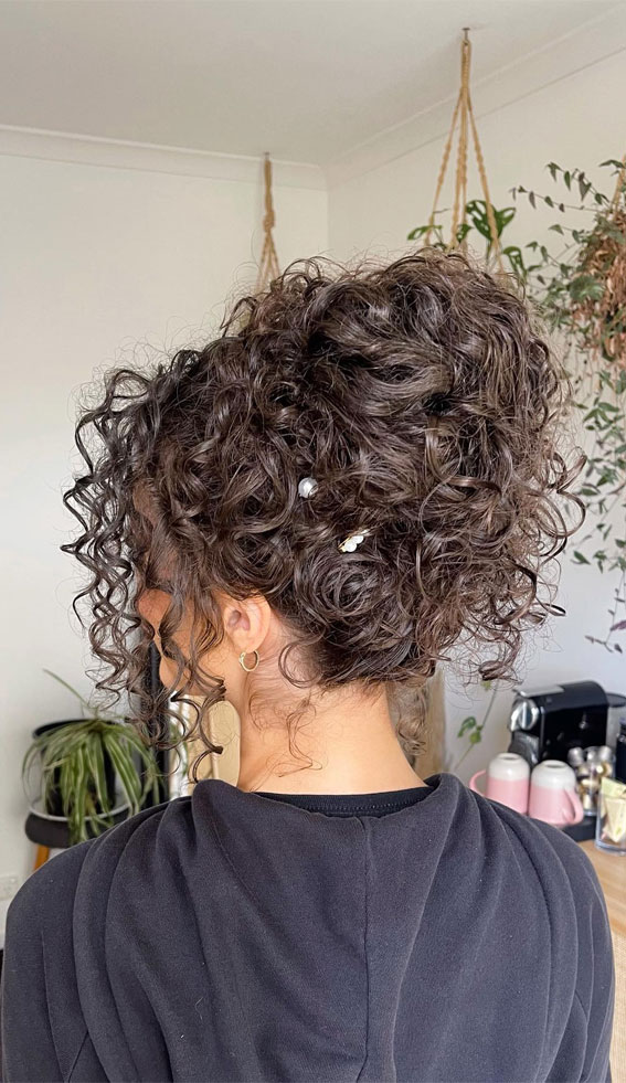 Elevate Your Look with Chic Hairstyling Ideas : A Tendril-Inspired Updo for Brunette Locks