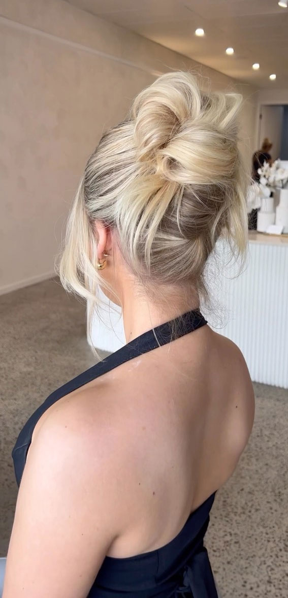 Elevate Your Look with Chic Hairstyling Ideas : Undone Knot High Bun