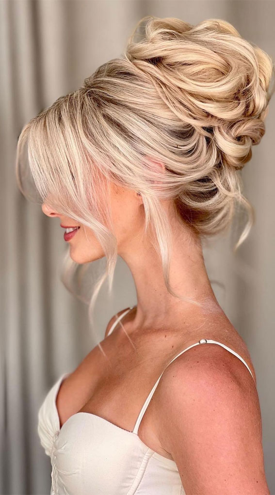 Elevate Your Look with Chic Hairstyling Ideas : Polished Top Bun