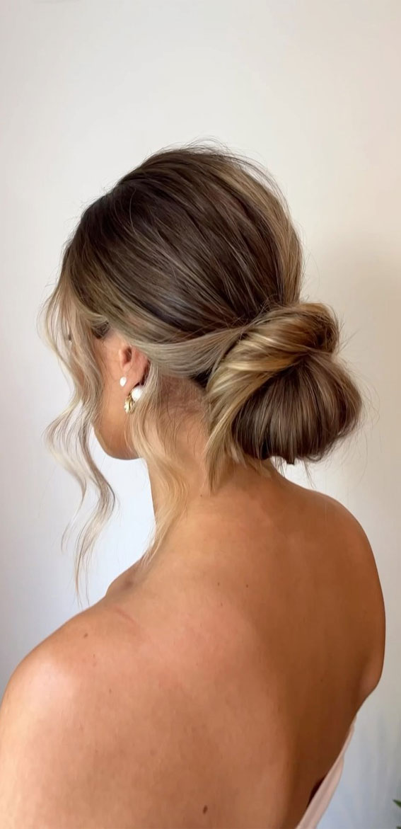 Elevate Your Look with Chic Hairstyling Ideas : Effortless Radiance The Low Bun Wedding Hairstyle