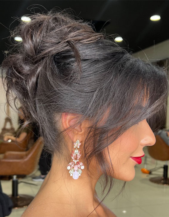 Elevate Your Look With Chic Hairstyling Ideas : Textured Top Bun Hairstyle for Brunette