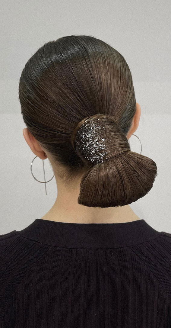 Elevate Your Look with Chic Hairstyling Ideas : Sleek & Elegantly Wrapped Ponytail Bun