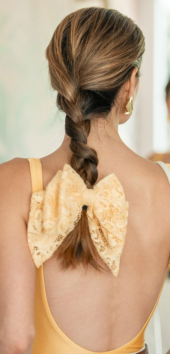 A Trendy Collection of Hairstyles Adorned with Chic Bows : Lace Pastel Yellow Bow on Braid