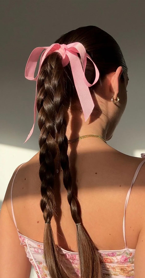 A Trendy Collection of Hairstyles Adorned with Chic Bows : Pink Bow Tied Double Braided Pigtails