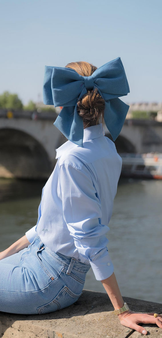 A Trendy Collection of Hairstyles Adorned with Chic Bows : Oversized Blue Bow on Bun