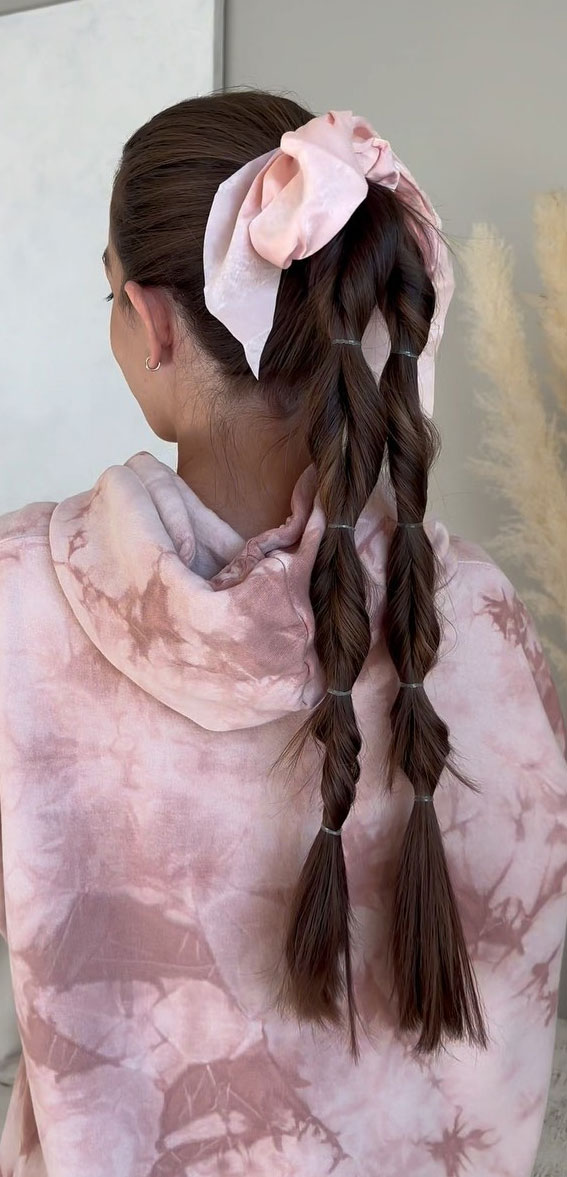 A Trendy Collection of Hairstyles Adorned with Chic Bows : Pull Through Double Braids with Pink Scrunchie Bow