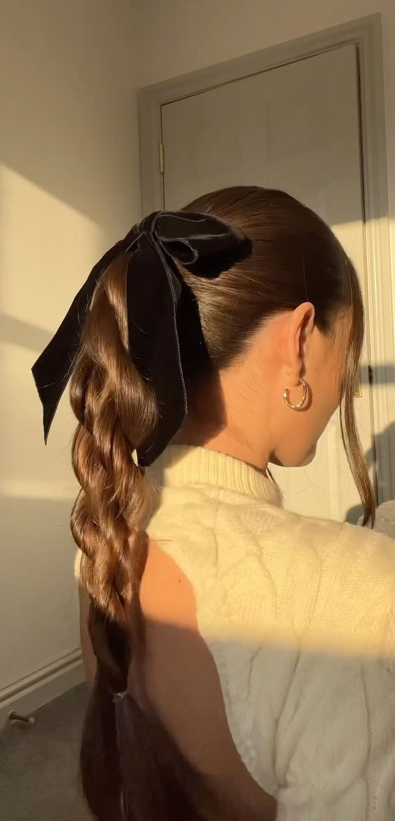 A Trendy Collection of Hairstyles Adorned with Chic Bows : Twisted Ponytail with Black Velvet Bow