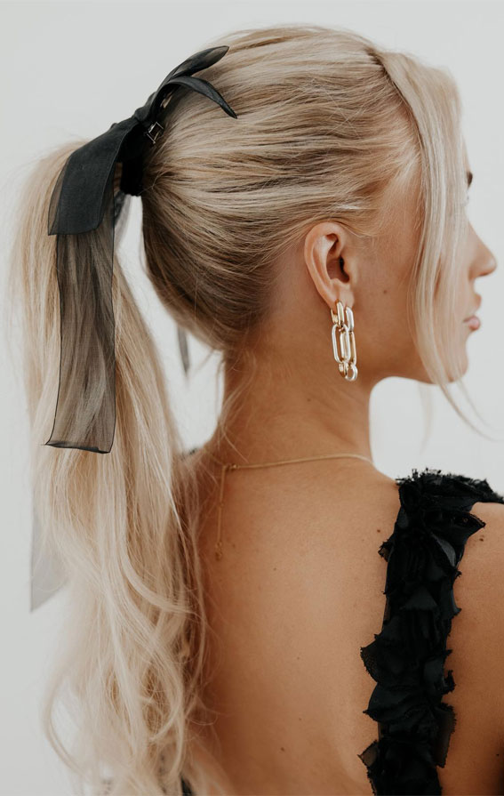 A Trendy Collection of Hairstyles Adorned with Chic Bows : Sheer Black Bow on Ponytail