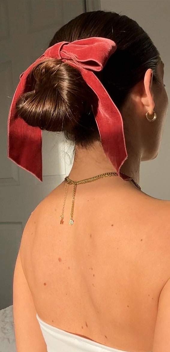 A Trendy Collection of Hairstyles Adorned with Chic Bows : Chignon with Dusty Rose Bow
