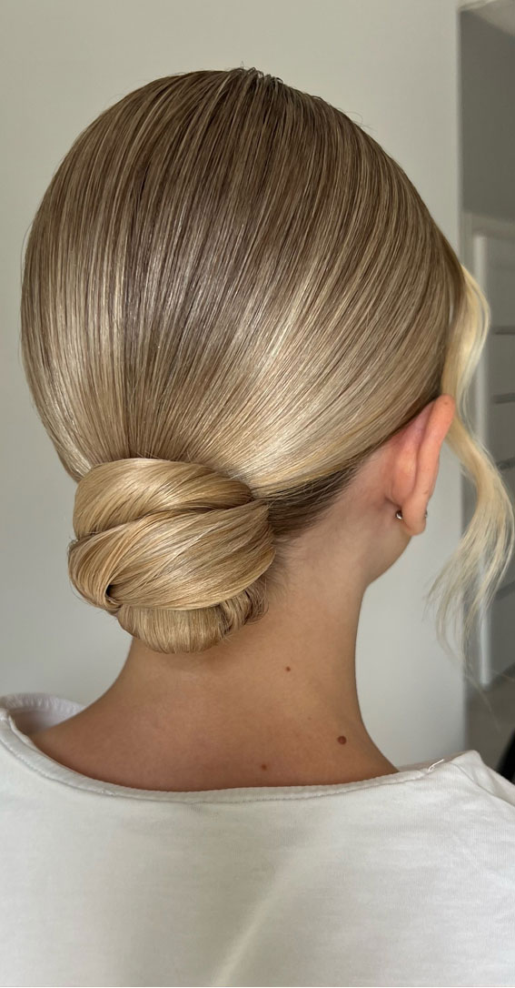 Hairdos to Steal the Spotlight on Every Special Occasion : Twisted Low Bun for Honey Blonde