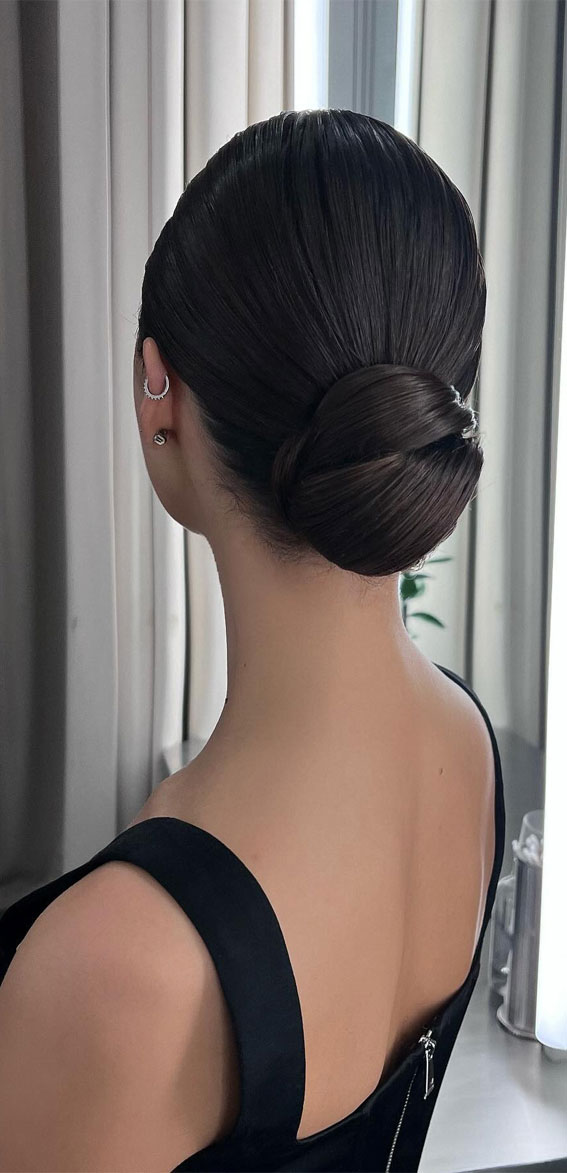 Hairdos to Steal the Spotlight on Every Special Occasion : Charming Dark Hair Low Bun