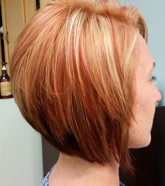 27 Exploring Stacked Haircuts for Modern Style : Copper Red with Blonde Highlights
