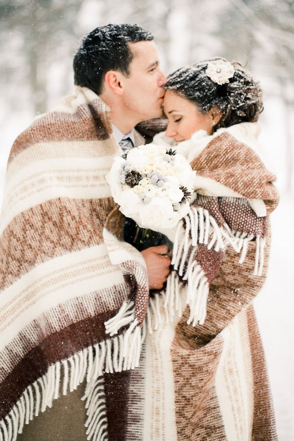 bride and groom in the snow