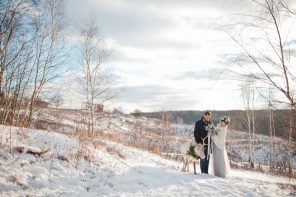 Light blue wedding dress + Muted grays and blues For an outdoor winter wedding shoot in the snow | fabmood.com #winterwedding #blueweddingdress #brideandgroom #snow