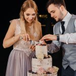 Cutting the cake - Semi naked wedding cake for a rustic boho wedding | fabmood.com #weddingcake #cake #nakedcake #nakedweddingcake