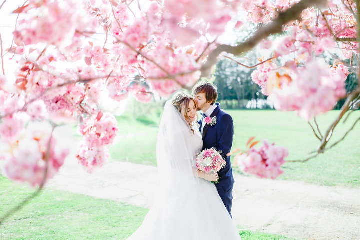 Soft pink and white Wedding for A Pretty, Relaxed and Fun Spring Time wedding At Hayne House | fabmood.com #springwedding #weddingportraits #brideandgroom #cherryblossoms #weddingphoto