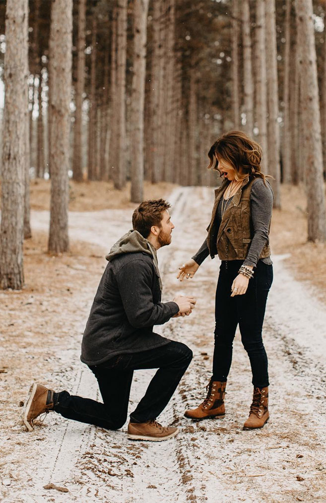 Surprise romantic proposal at a Christmas tree farm