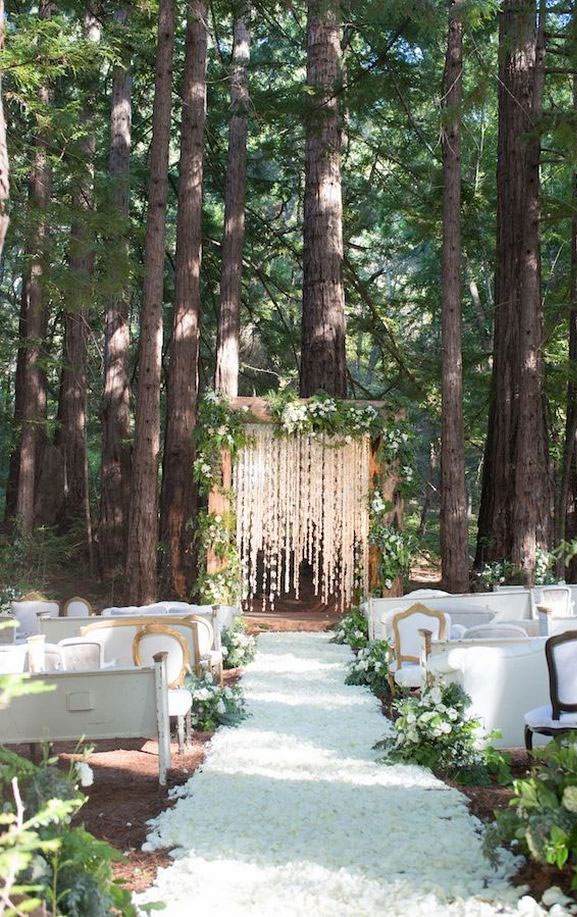 7 Wedding Arches That Will Instantly Upgrade Your Ceremony - Enchanted forest wedding decorations #weddingarch #weddingdecor